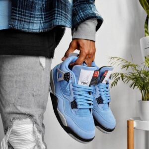 "Jordan Retro 4 University Blue sneakers featuring premium suede upper with black and white accents, perfect for a trendy and comfortable look."