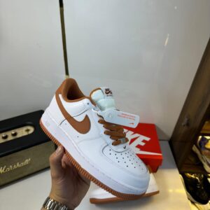 Side view of Nike Airforce Girls sneaker showcasing sleek design.