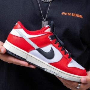 Front view of Nike SB Dunk Low Split CHICAGO showcasing red and white leather upper.