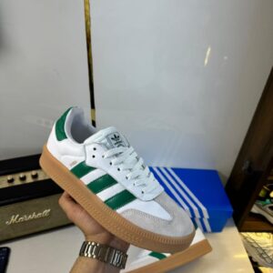 Side view of Adidas Green Samba Dual sneakers in stock