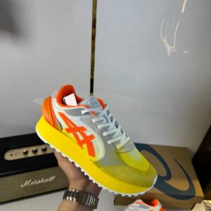 Front view of Onitsuka Tiger Moage showcasing sleek design