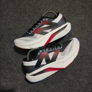 Side view of New Balance SC Elite White Black Red sneakers