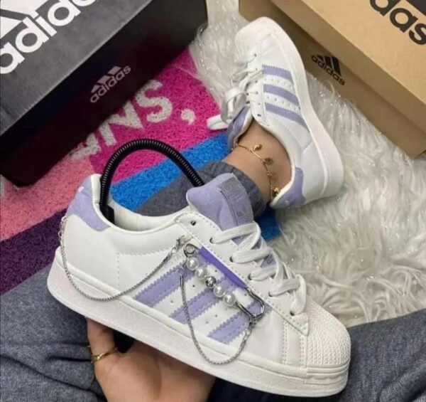 "Front view of Adidas Superstar Chain sneakers for girls, featuring a stylish chain detail."