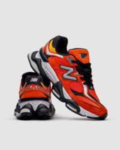 "New Balance 9060 Fire Sign front view showcasing the bold red accents and breathable mesh upper"