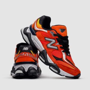 "New Balance 9060 Fire Sign front view showcasing the bold red accents and breathable mesh upper"