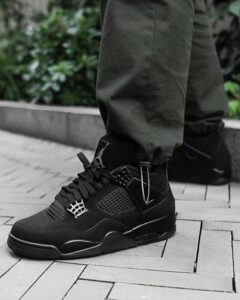 Air Jordan Retro 4 Black Cat sneakers in black color, featuring a sleek design and semi UA quality.