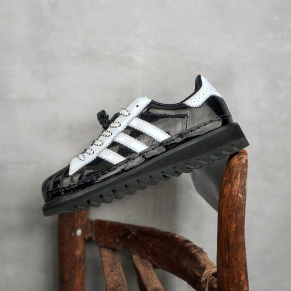 Adidas X Clot Superstar by Edison Chen in white and black showcasing premium quality and stylish design.