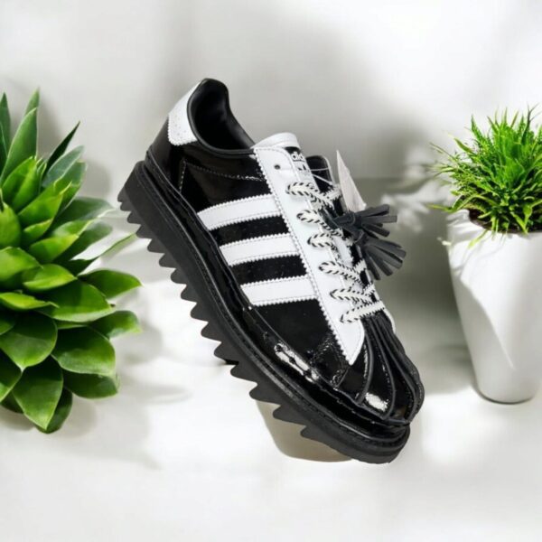 Adidas X Clot Superstar by Edison Chen in white and black showcasing premium quality and stylish design.