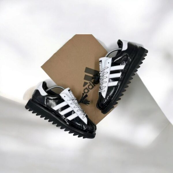 Adidas X Clot Superstar by Edison Chen in white and black showcasing premium quality and stylish design.