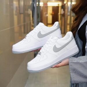 Nike Air Force 1 '07 Light Smoke Grey with premium leather upper and clean white midsole for a fresh, versatile look.