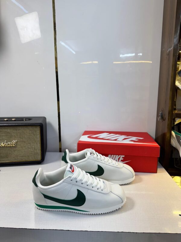 Front view of Nike Cortez George Green sneakers.