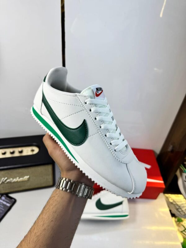 Front view of Nike Cortez George Green sneakers.